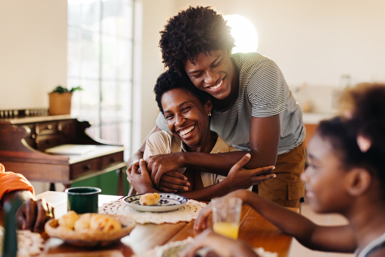 Family enjoying breakfast together at home