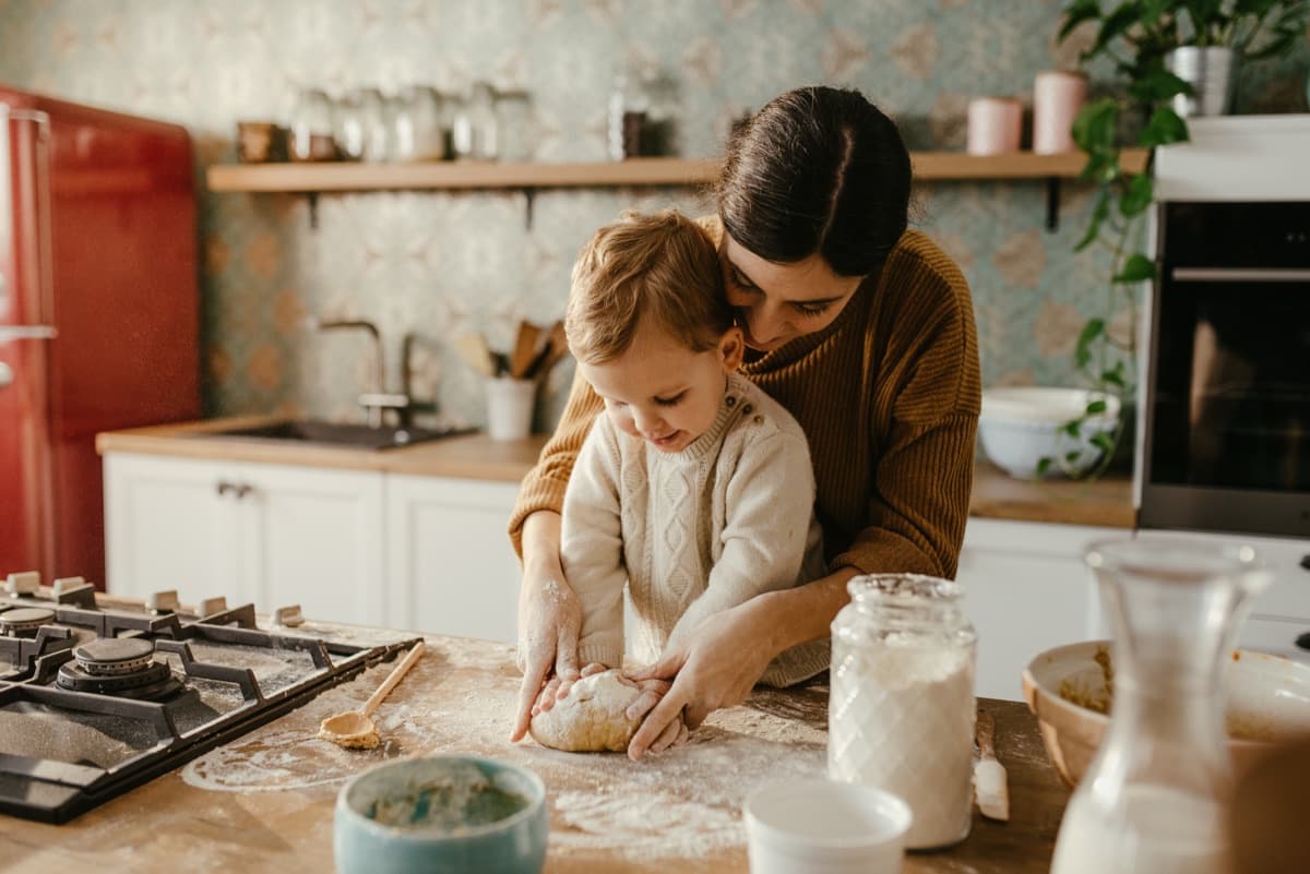 Parent and child baking together in the kitchen