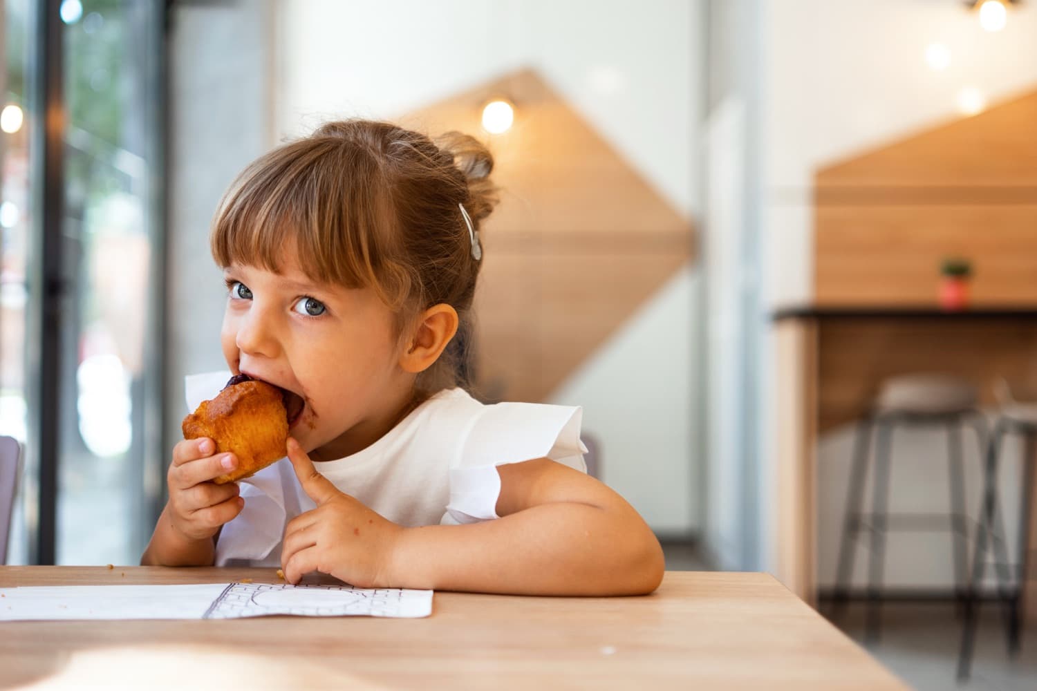 A happy child enjoying a snack without fear of food allergies